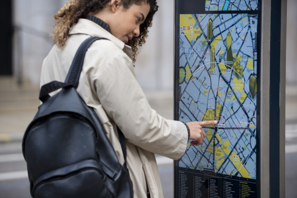 young woman consulting station map city