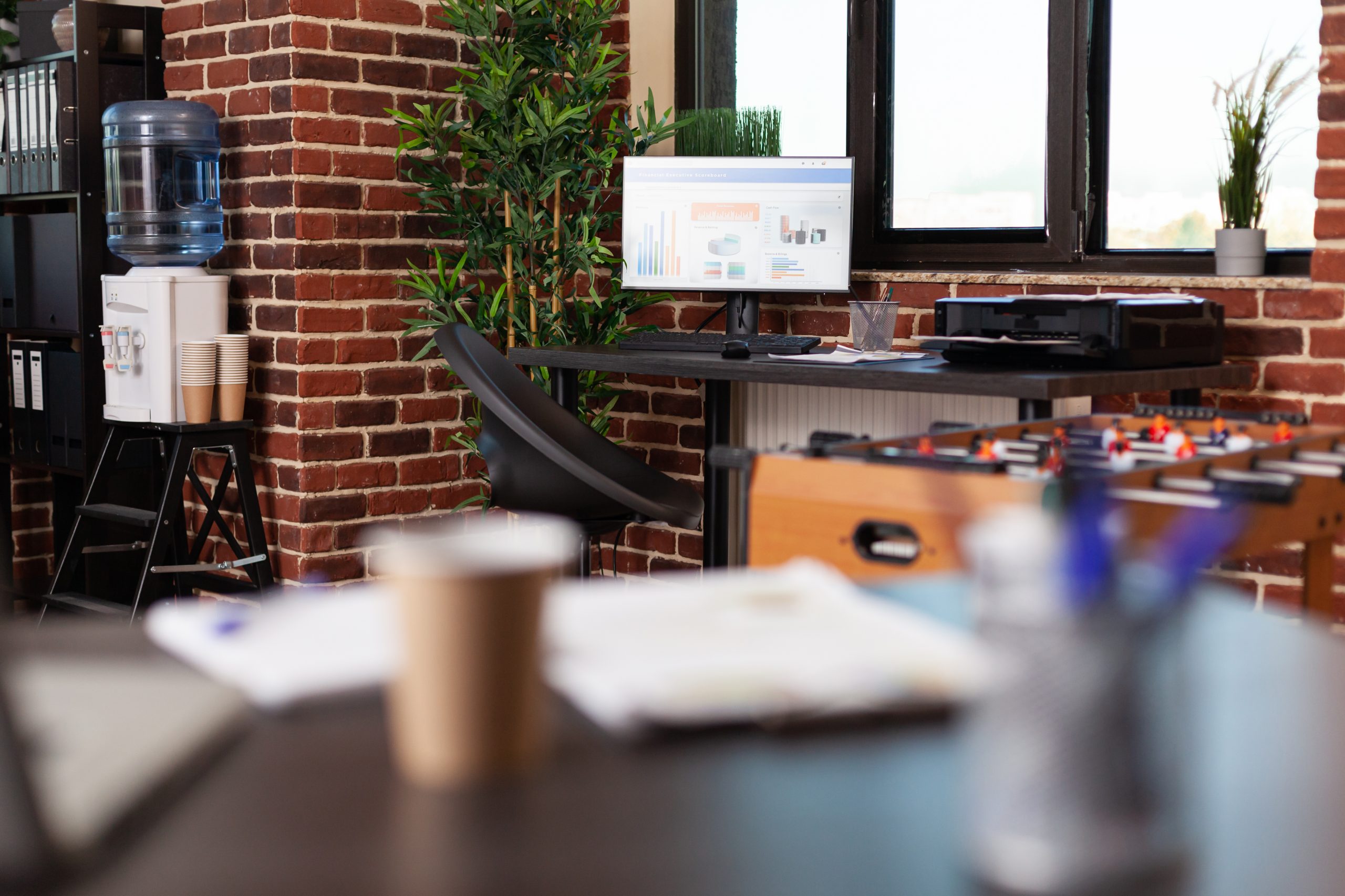 close up monitor work instruments wooden desk empty business space computer with charts display supplies paperwork finance modern workspace decor scaled