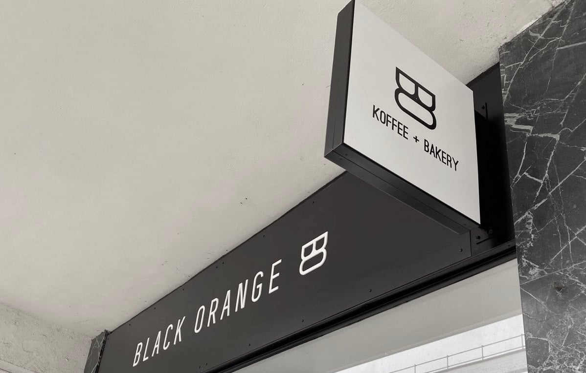 Black Orange_hospitality_ Tray Sign_ Projecting Sign